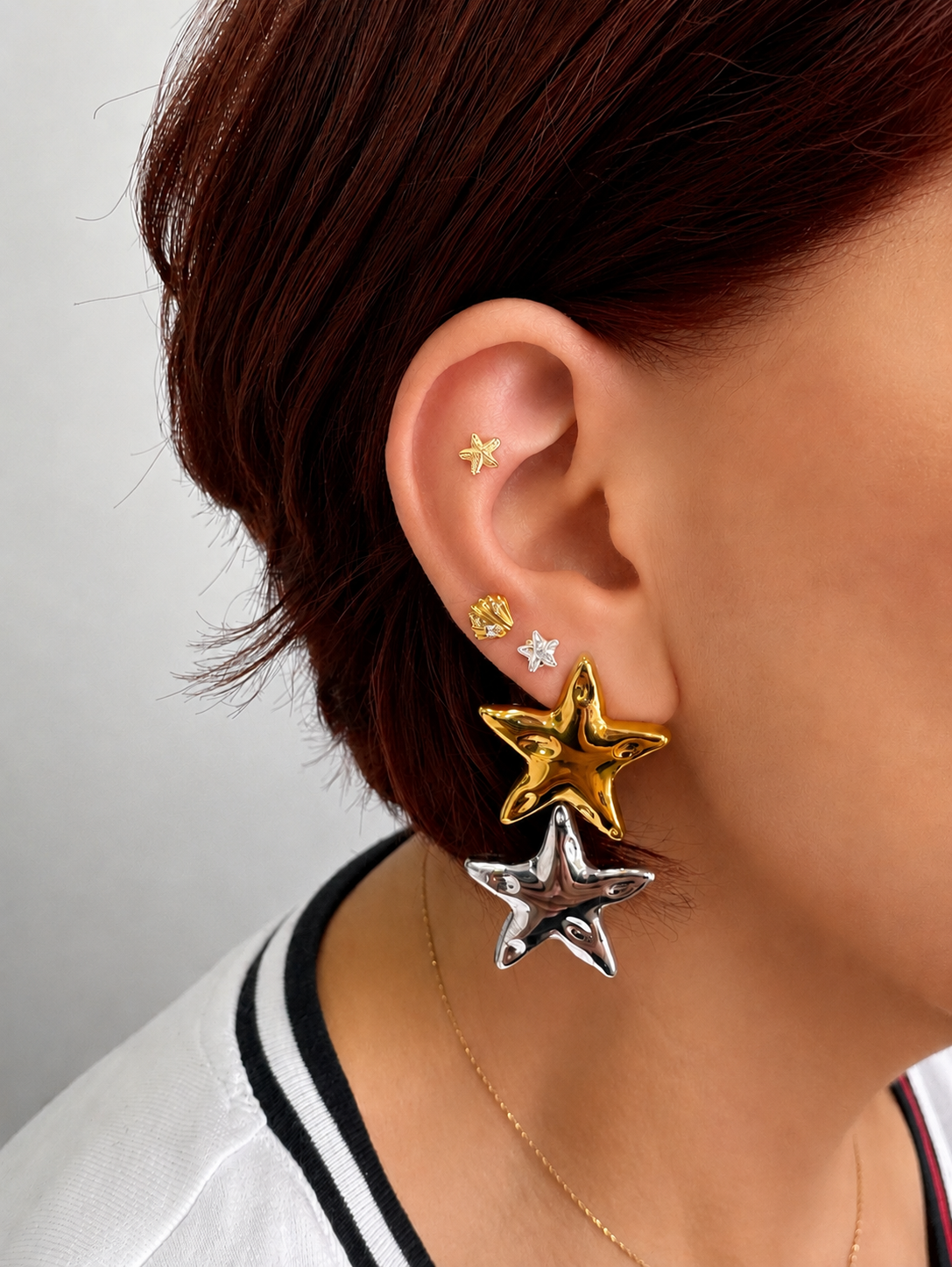 Piercing estrella zirconia oro 10k